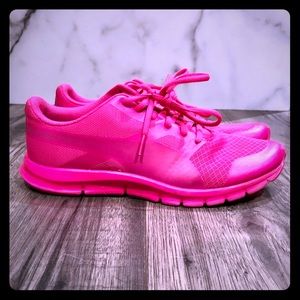 Bright pink Puma sneakers